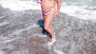 Ellie on the Beach changes Swimsuits and at Times Naked - 2 image