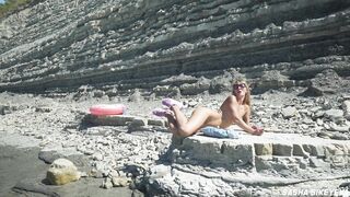 Awesome kinky nudist girl in sunglasses sucks & rides a huge dildo in public beach - Sasha Bikeyeva - 5 image