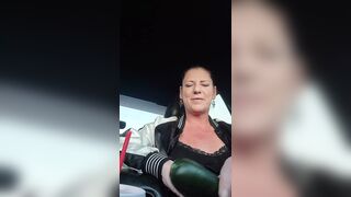 MILF Masturbates and Squirts with Huge Cucumber in Grocery Store Parking Lot - 1 image