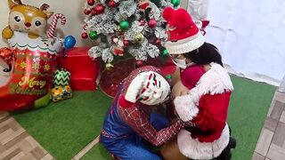 Watch two stunning stepsisters pleasure Spidey with a hot threesome at Christmas