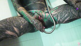 Petite tattooed model squirts while fingering her tight ass in the shower