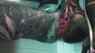 Petite tattooed model squirts while fingering her tight ass in the shower